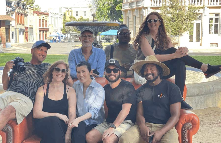 Group of people sit on a couch