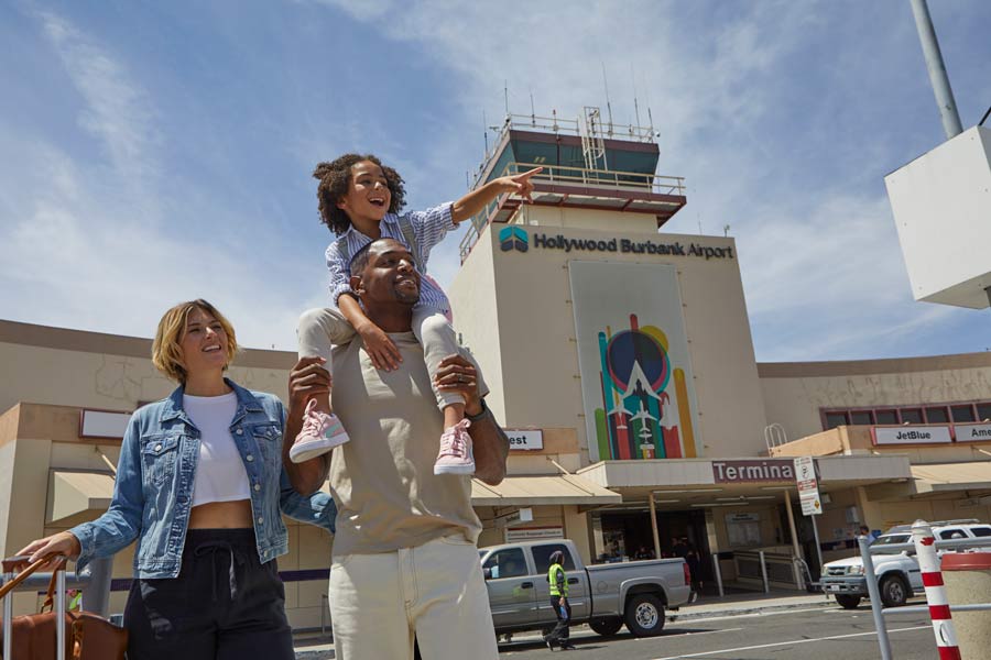Family walk out of the Hollywood-Burbank Airport