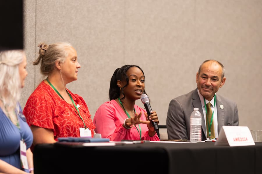 Panelists discuss arts, media, and education topics during a Q&A session at the AME Institute conference.